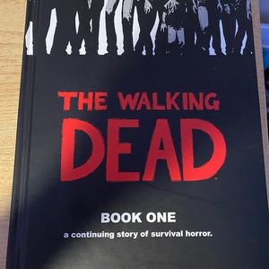 Walking dead hard cover book one graphic novel.